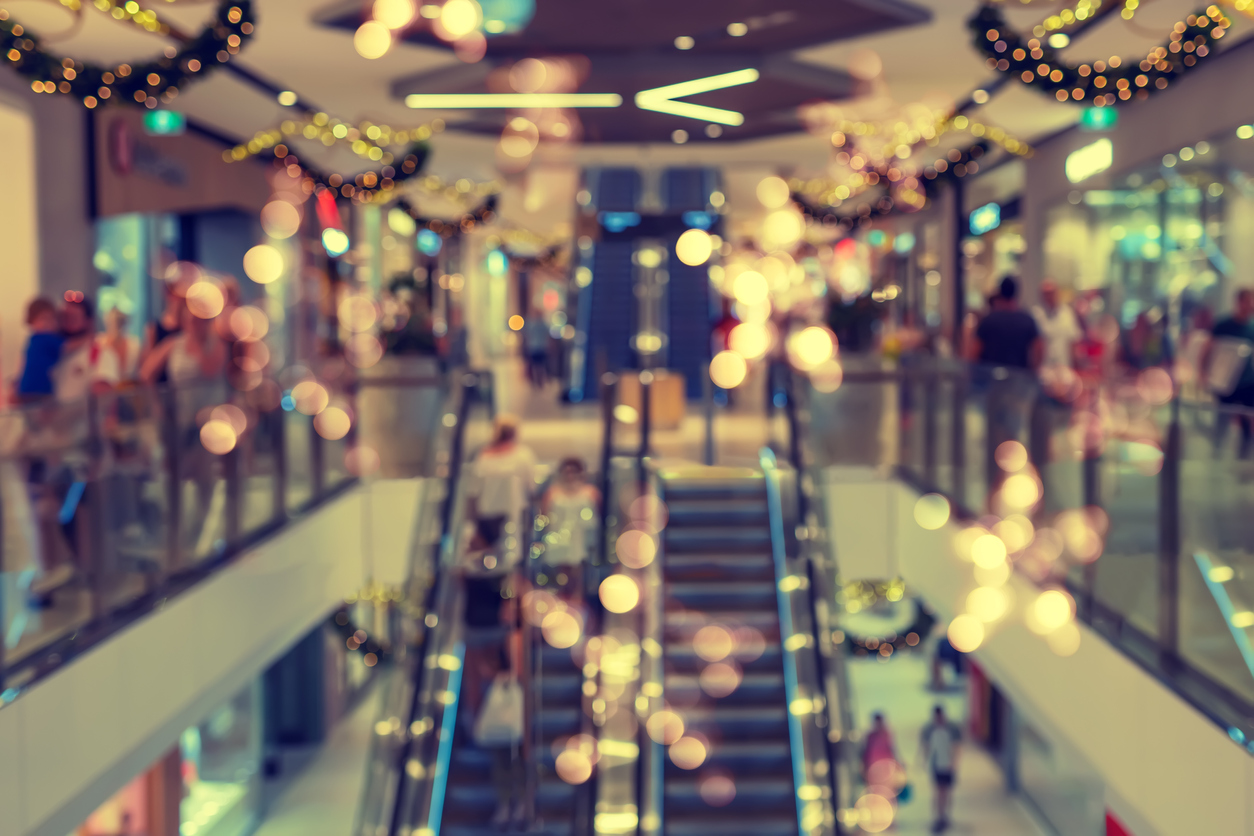 Abstract blurred shopping mall interior with Christmas decorations for background